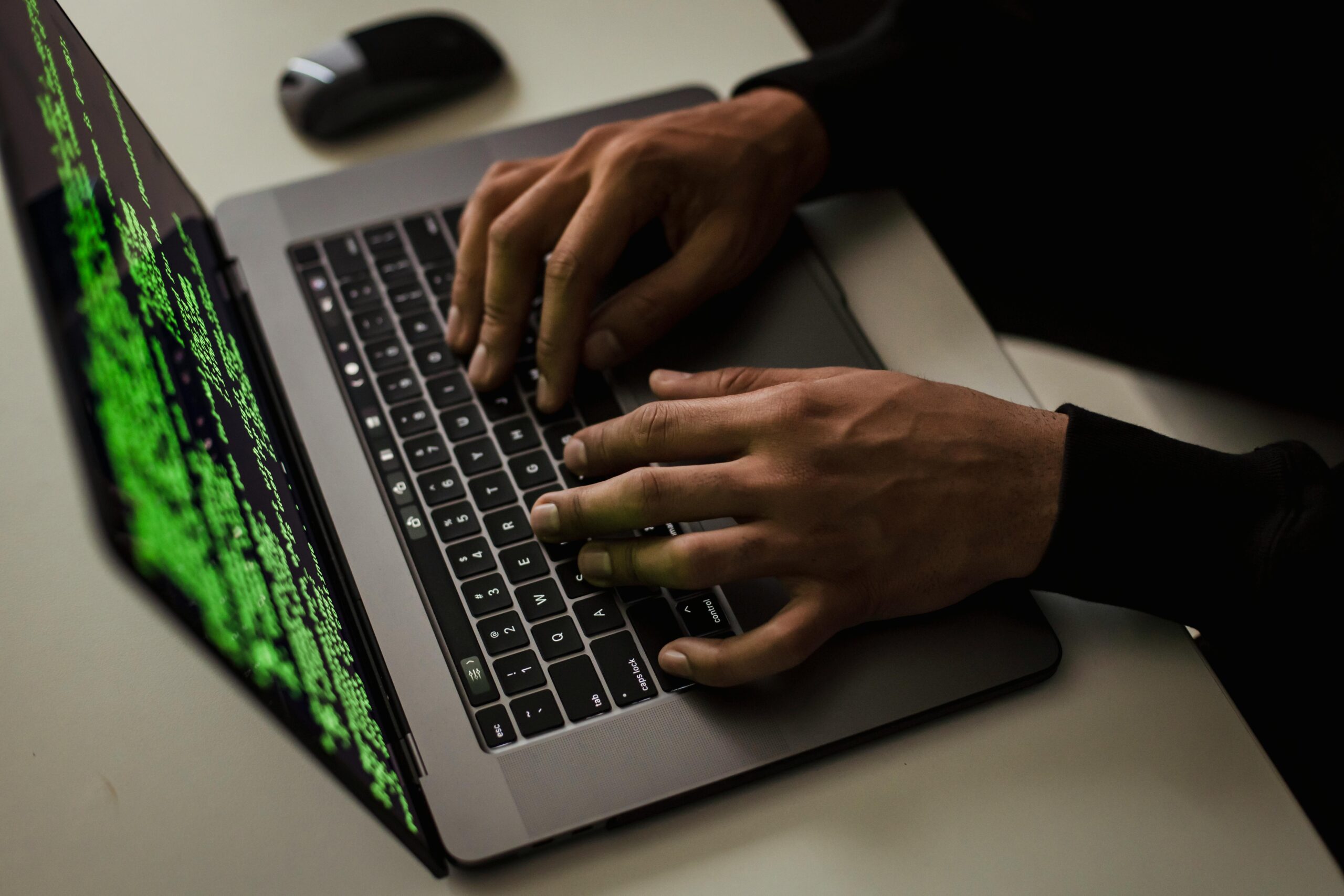 Crop-cyber-spy-hacking-system-while-typing-on-laptop