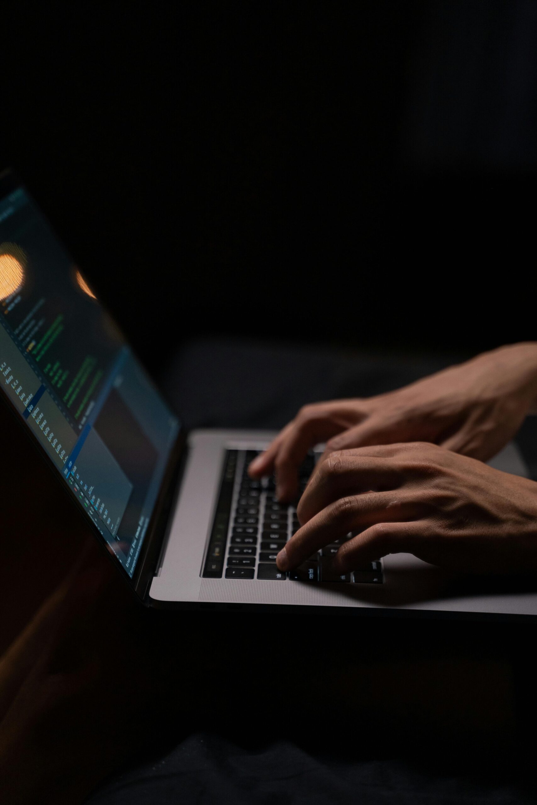 Person-using-silver-and-black-laptop-computer