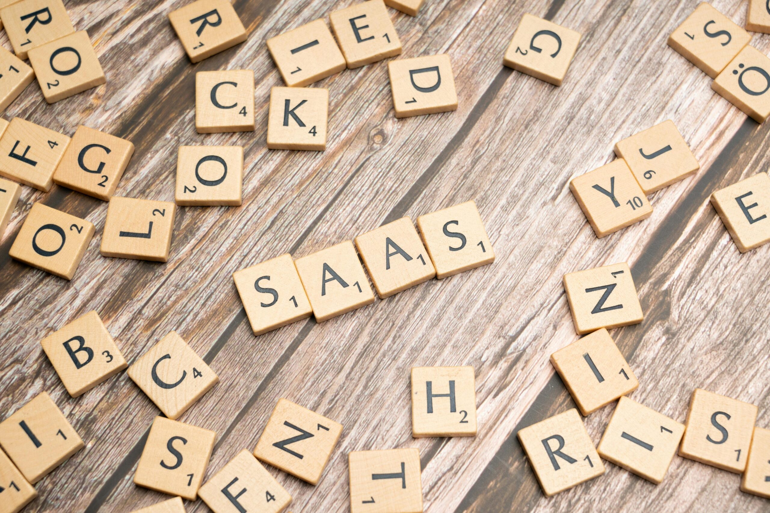 Scrabble-letters-spelling-saas-on-a-wooden-tabl